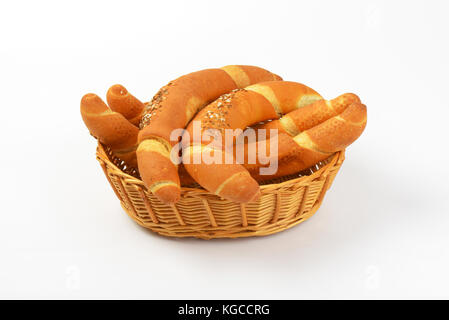 scuttle of fresh bread rolls on white background Stock Photo