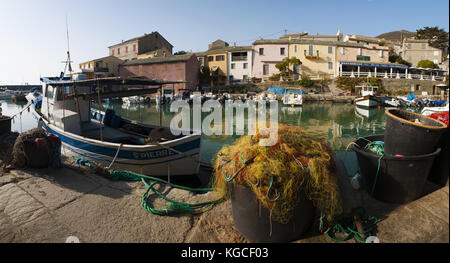 Corsica: fish nets and fishing boats in Centuri Port, the little harbour town on the Cap Corse peninsula, on the western side of Cap Corse Stock Photo