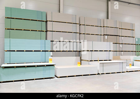 gypsum board stacks at indoor warehouse Stock Photo