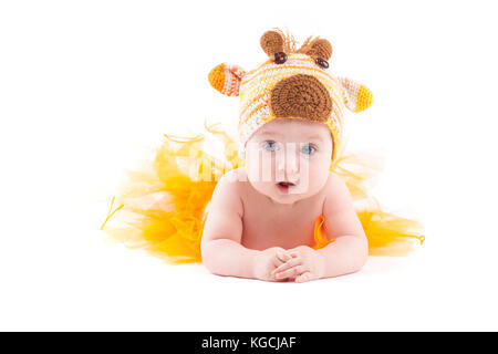 beautiful cute baby girl in deer costume lies on tummy Stock Photo