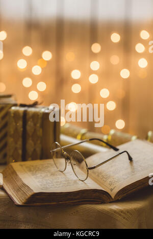 Holy bible book with eyeglasses Stock Photo