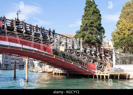 Restoration work being done on the Accademia Bridge, Grand Canal, Venice , Italy funded by Luxottica eye glasses Group Stock Photo