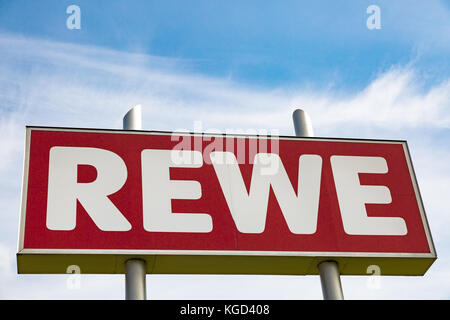 HUETTENBERG, GERMANY MAY, 2017: REWE supermarket chain sign, based in ...