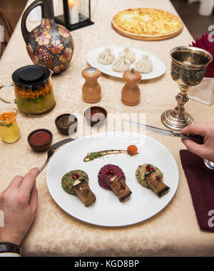 Man eating in georgian restaurant Stock Photo