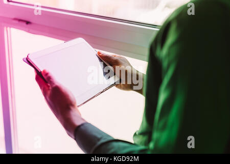 Close up on the hand on a businessman holding tablet - technology, business, working concept Stock Photo