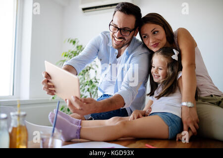 Happy family taking selfie in their house Stock Photo