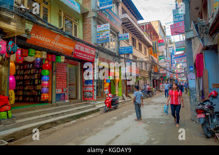 THAMEL, KATHMANDU NEPAL - OCTOBER 02, 2017: Streets of Thamel, with some people walking and buying. Thamel is a commercial neighbourhood in Kathmandu, the capital of Nepal. One of the popular tourist attraction in Kathmandu Stock Photo