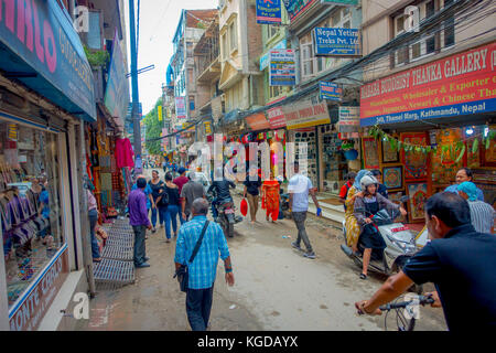 THAMEL, KATHMANDU NEPAL - OCTOBER 02, 2017: Streets of Thamel, with some people walking and buying. Thamel is a commercial neighbourhood in Kathmandu, the capital of Nepal. One of the popular tourist attraction in Kathmandu Stock Photo