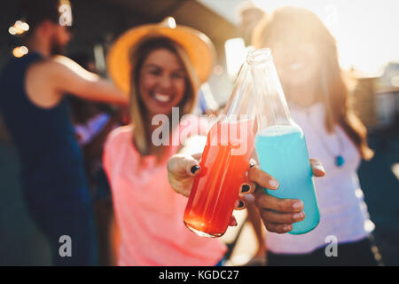 Happy young girls having fun at party Stock Photo