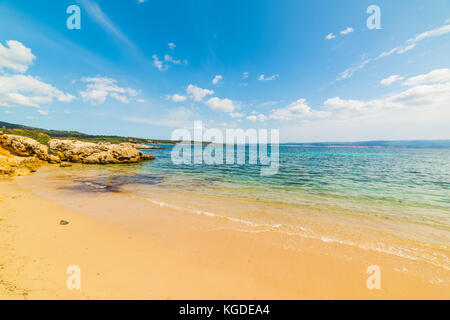 Golden sand in a small cove in Alghero Stock Photo