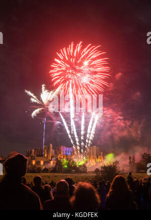 People watching Fireworks display at bonfire 4th of November celebration, Kenilworth Castle, united kingdom. Stock Photo