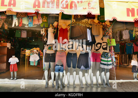 Colorful clothes are displayed in front of local store in Mexico Stock Photo