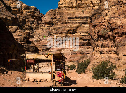 Souvenir stall and goats on mountain walking route to Ad Deir, the Monastery, Petra, Jordan, Middle East Stock Photo