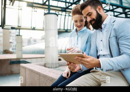 Business colleagues talking on break from work Stock Photo