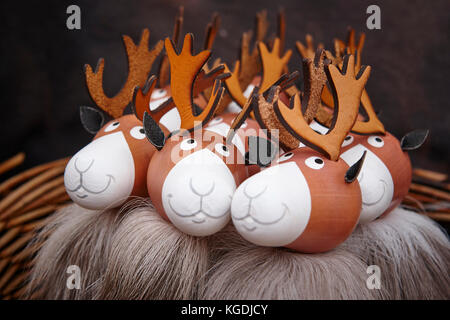 Painted wooden reindeers bundle. Christmas background celebration. Holiday season. Horizontal Stock Photo