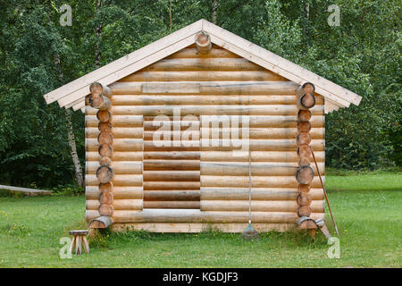 Wooden cabin in the forest under construction. Raw materials. Finland Stock Photo