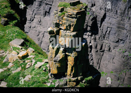 Stack rock formation at the foot of the Cliffs of Moher, Liscannor, Co. Clare, Ireland Stock Photo
