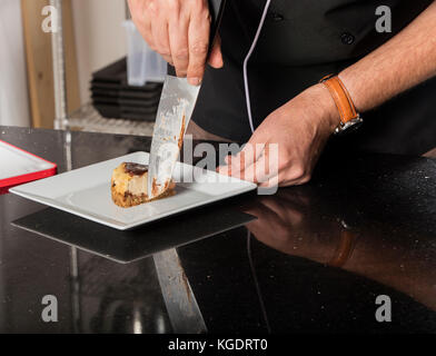 chef preparing cheese cake in the kitchen Stock Photo