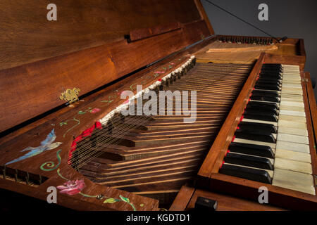 Details of an old baroque clavichord strings keyboard painting Stock Photo