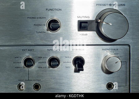 Front panel section of audio power amplifier with switches and knobs ...
