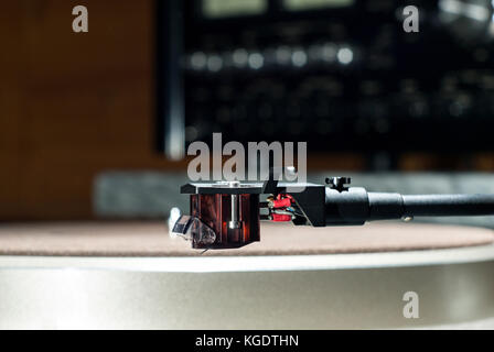 Moving magnet cartridge on the tonearm on a blurred background Stock Photo