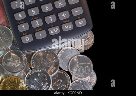 Top view / Flat Lay of Illustration for Spending money and payments in isolated black template with calculator Stock Photo
