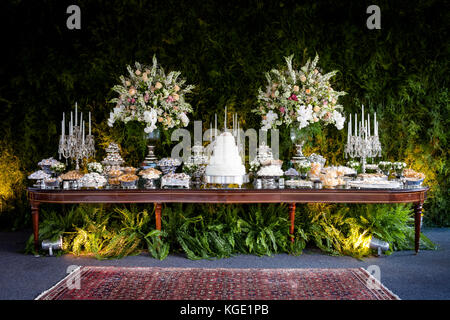 An elegant and impressive cake and candy  table for a wedding Stock Photo