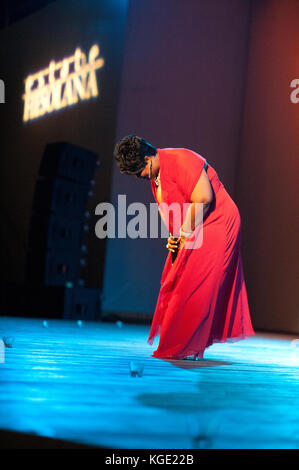 Gospel afro american mature famous singer performing during a night concert. Christmas event at Fiesole, Florence Italy Stock Photo