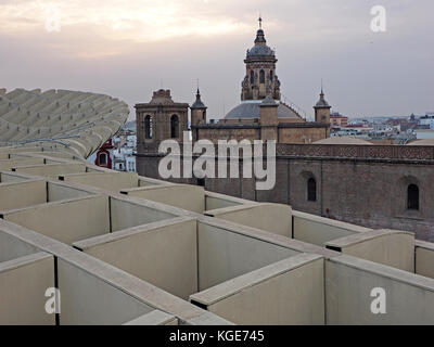 view across dusk skyline of Seville with domes and towers from the walkway on the  Metropol Parasol 'The Mushroom' Seville, Spain Stock Photo