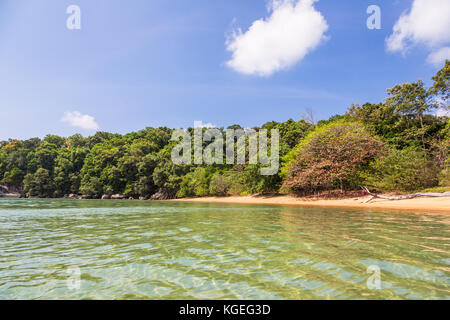 Idyllic empty beach in Tioman island in the South China Sea in Malaysia on a sunny day in Southeast Asia. Stock Photo