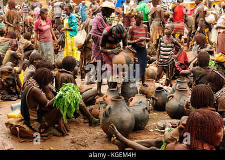 DIMEKA, OMO VALLEY, ETHIOPIA - JULY 27: The people from Hamer people on the local marketplace in Dimeka, Omo valley in July 27, 2013 Stock Photo