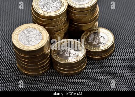 One pound coin coins stack stacks Stock Photo