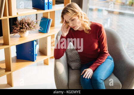 Unhappy young woman feeling depressed Stock Photo