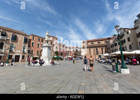 City of Venice Italy. The Campo Santo Stefano public square with the Niccolo Tommaseo monument in the foreground. Stock Photo