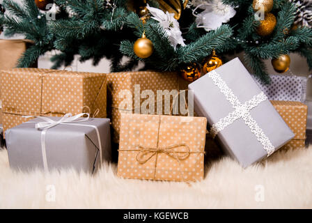 Many boxes with Christmas gifts under the Christmas tree Stock Photo