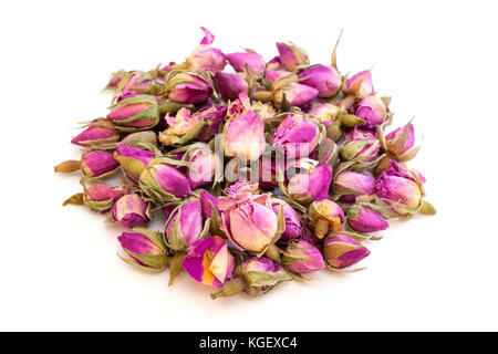 Pink dried rosebuds on a white background Stock Photo