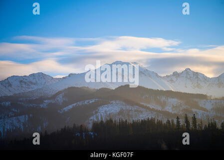 Winter mountains covered with snow, view from a big meadow in Tatry mountains in Poland Stock Photo