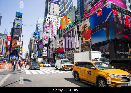 Unidentified people on the Times Square, New York. Times Square is the most popular tourist location in New York City Stock Photo