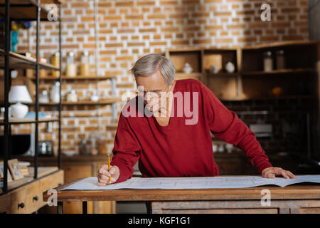 Smart hard working engineer working on his project Stock Photo