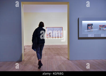 London, UK. 7th Nov, 2017. A visitor prepares to view 'Stakhanovites', 1937, by Aleksandr Deineka at a Preview of 'Red Star Over Russia: A Revolution in Visual Culture 1905-55' at Tate Modern. The exhibition marks the centenary of the October Revolution and presents the visual history of Russia and the Soviet Union with works drawn primarily from the collection of the late graphic designer David King. Credit: Stephen Chung/Alamy Live News Stock Photo