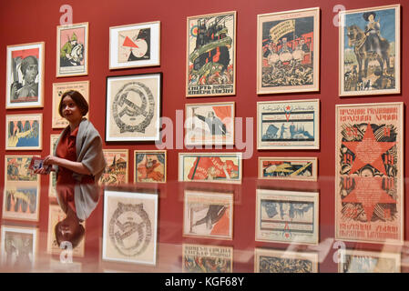 London, UK. 7th Nov, 2017. A lecturer gives a talk on Soviet political propaganda posters at a preview of 'Red Star Over Russia: A Revolution in Visual Culture 1905-55' at Tate Modern. The exhibition marks the centenary of the October Revolution and presents the visual history of Russia and the Soviet Union with works drawn primarily from the collection of the late graphic designer David King. Credit: Stephen Chung/Alamy Live News Stock Photo