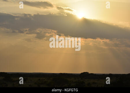 Bright Sun rays Shining though Clouds Stock Photo