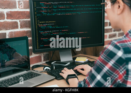 pretty woman worker programmer using computer working in office and typing coding developed new online system. selective focus photo. Stock Photo