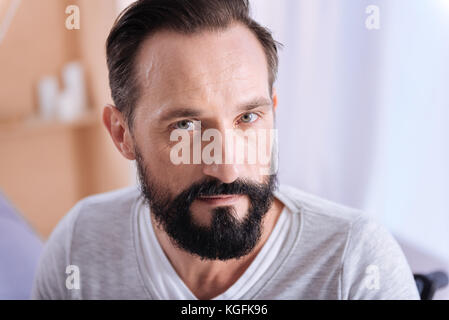 Concentrated grey-eyed man of middle age Stock Photo
