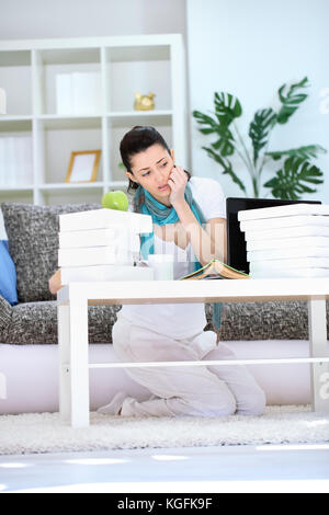 Frustrated student with a lot of homework. Stock Photo