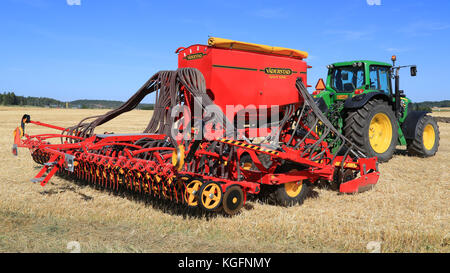 SALO, FINLAND - AUGUST 21, 2015: Vaderstad Spirit 600C Seed Drill and John Deere 7340 tractor on field at the set up of Puontin Peltopaivat Agricultur Stock Photo