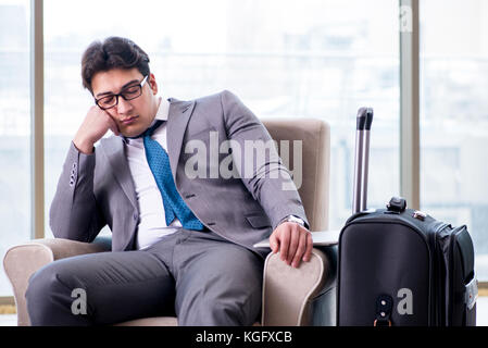 Young businessman in airport business lounge waiting for flight Stock Photo