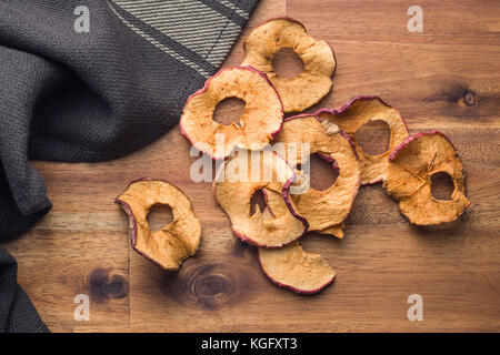 Dried apple slices on wooden table. Stock Photo