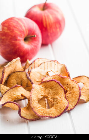 Dried apple slices on white table. Stock Photo