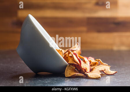 Dried apple slices in bowl. Stock Photo